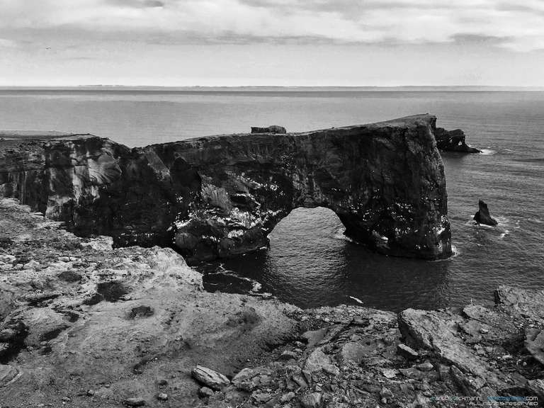 Oceanic coast with dark cliffs