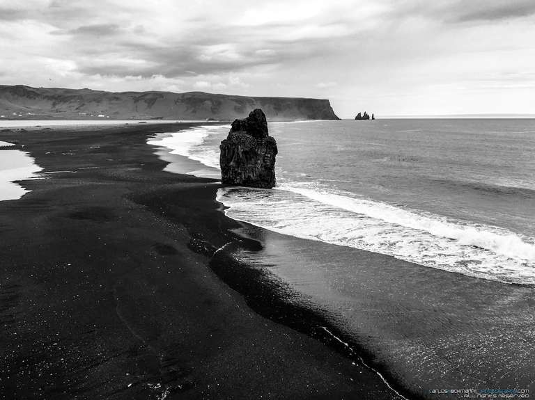 black sand beach located in Reynisfjara in Iceland.