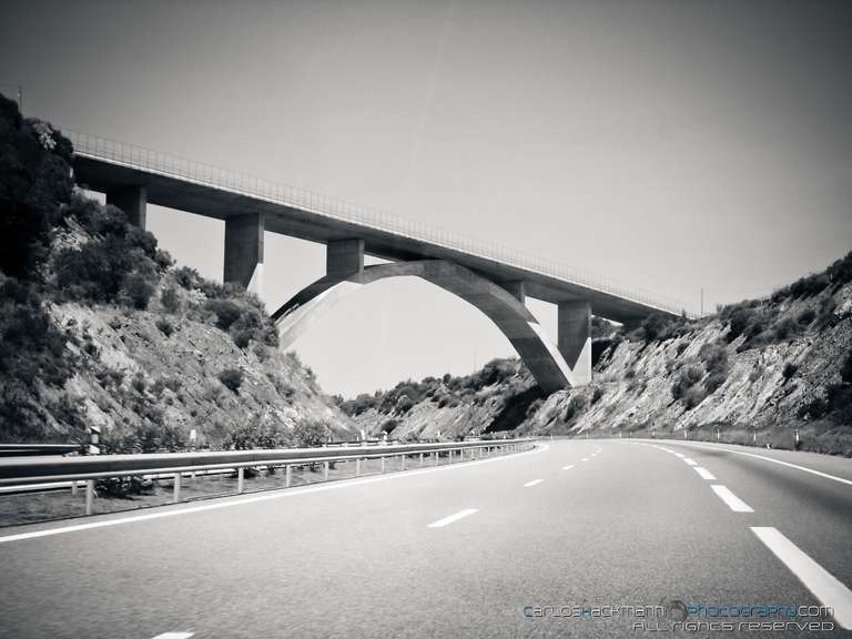 a bridge crossing a highway